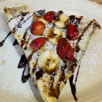 The Original Crepe · Strawberries and bananas, chocolate sauce and pecans on top.