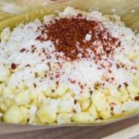 Esquite · Sweet corn (served warm), mayonnaise, crumbled queso cotija ,chili powder and lime juice.