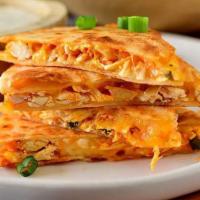 Buffalo Chicken Quesadilla  · Cooked tortilla that is filled with cheese and folded in 1/2.