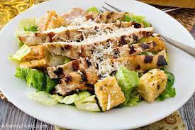 Grilled Chicken Caesar Salad  · Green salad with Caesar dressing and cheese. 