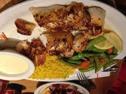 Broiled Seafood Combination with Vegetables Dinner · Flounder (1), shrimp (3), scallops (3).