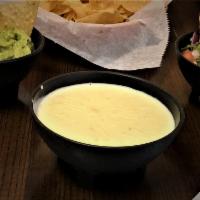 White Cheese Dip & Chips · A creamy blend of white American cheese, bursting with Mexican Zest