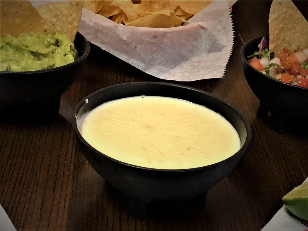 White Cheese Dip & Chips · A creamy blend of white American cheese, bursting with Mexican Zest