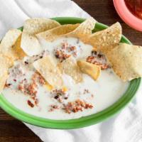 Chorizo Dip & Chips · Grilled Mexican chorizo sausage thrown in  our flavourful authentic white cheese dip.