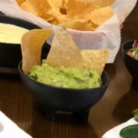 Guacamole Dip & Chips · A delightful mix of fresh avocado, onion and tomato with a hint of cilantro and jalapeno - H...