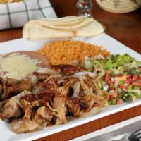 Carnitas Dinner  · Braised Pork tips, rice, beans, and guacamole salad served with tortillas and fried onions.