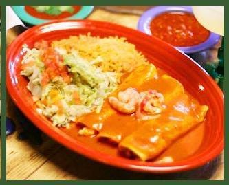 Shrimp Enchiladas · 3 rolled corn tortillas filled with grilled shrimp and cheese, topped with enchilada sauce, and served with guacamole salad and rice.