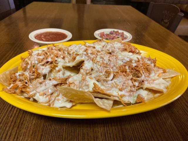 Full Order Chicken Nachos · A bed of crispy tortilla chips, smother with cheese dip, topped with chicken (chicken is already cooked with onion, bell peppers and tomato)