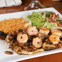 Pollo Cancun · Grilled chicken breast and shrimp cooked with pico de gallo and mushrooms. Served with rice,...