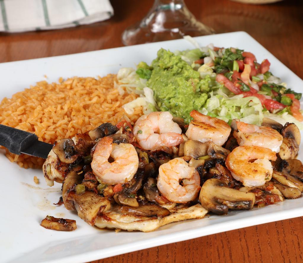 Pollo Cancun · Grilled chicken breast and shrimp cooked with pico de gallo and mushrooms. Served with rice, guacamole salad, and tortillas.
