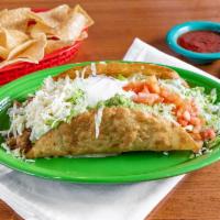 Taco Salad Fajitas · A Large crispy flour Taco with melted cheese sauce topped with your choice of chicken or ste...