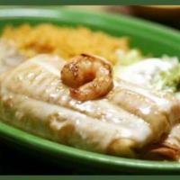 Shrimp Chimichanga · A flour tortilla deep-fried, filled with shrimp and cheese, and topped with shrimp. Served w...