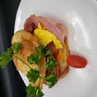 Breakfast Croissant, Egg, Ham, and 5 Cheese Blend · Served on a flaky French pastry. 