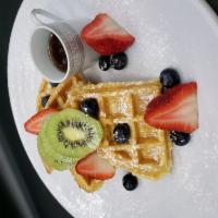 Breakfast Waffles & Berries · Served on a crisp and fluffy cake.