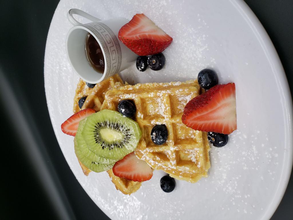 Breakfast Waffles & Berries · Served on a crisp and fluffy cake.