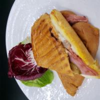 Media Noche Sandwich · Thin Slices of roast Pork, Ham, Swiss Cheese, Mustard, Mayonnaise, Pickles in between Toaste...
