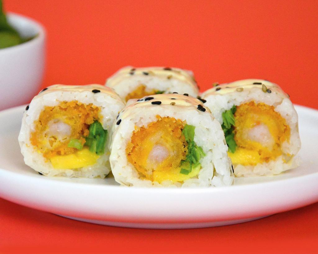 Pekin Roll · Shrimp tempura, mango, scallions rolled on soy paper with sesame seeds and passion fruit mayo on top