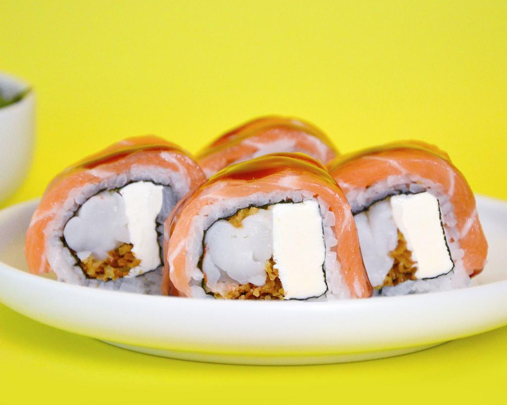 Phoenix Roll · Steamed wild white shrimp, philadelphia and crispy onion, topped with scottish salmon and eel sauce