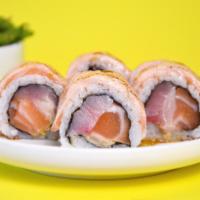 Revolution Roll · Japanese Hamachi, Scottish Salmon, fresh ginger and spicy mayo topped with salmon torched an...