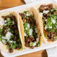 Asada Taco · Hand Made Tortillas, Including Onion, Cilantro And Lime.  