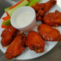 Chicken Wings · Choose from BBQ, Buffalo sauce or spicy honey BBQ. comes with carrots, celery and ranch dres...
