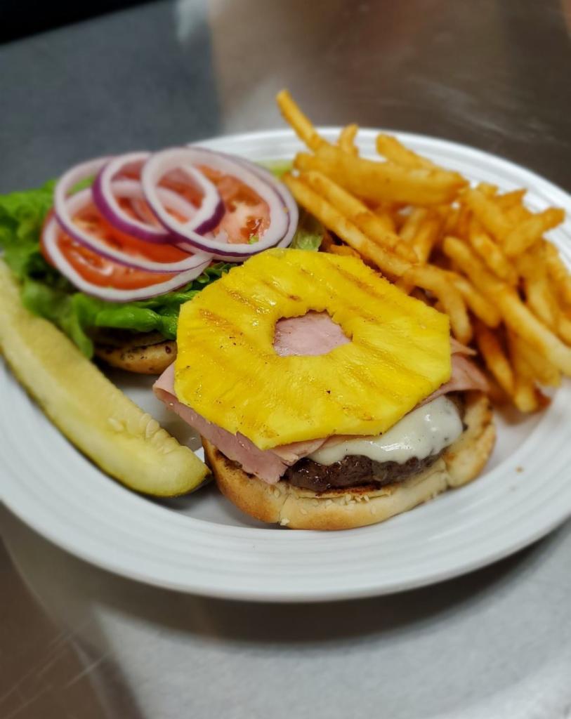 Hawaiian Burger · 6 oz. patty served with ham, grilled sweet pineapple, Provolone cheese, 1000 Island, tomatoes, onion and lettuce on toasted sesame bun.

