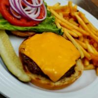 Cheeseburger · 6 oz. patty served with American cheese, tomatoes, lettuce, and onions on toasted sesame bun.
