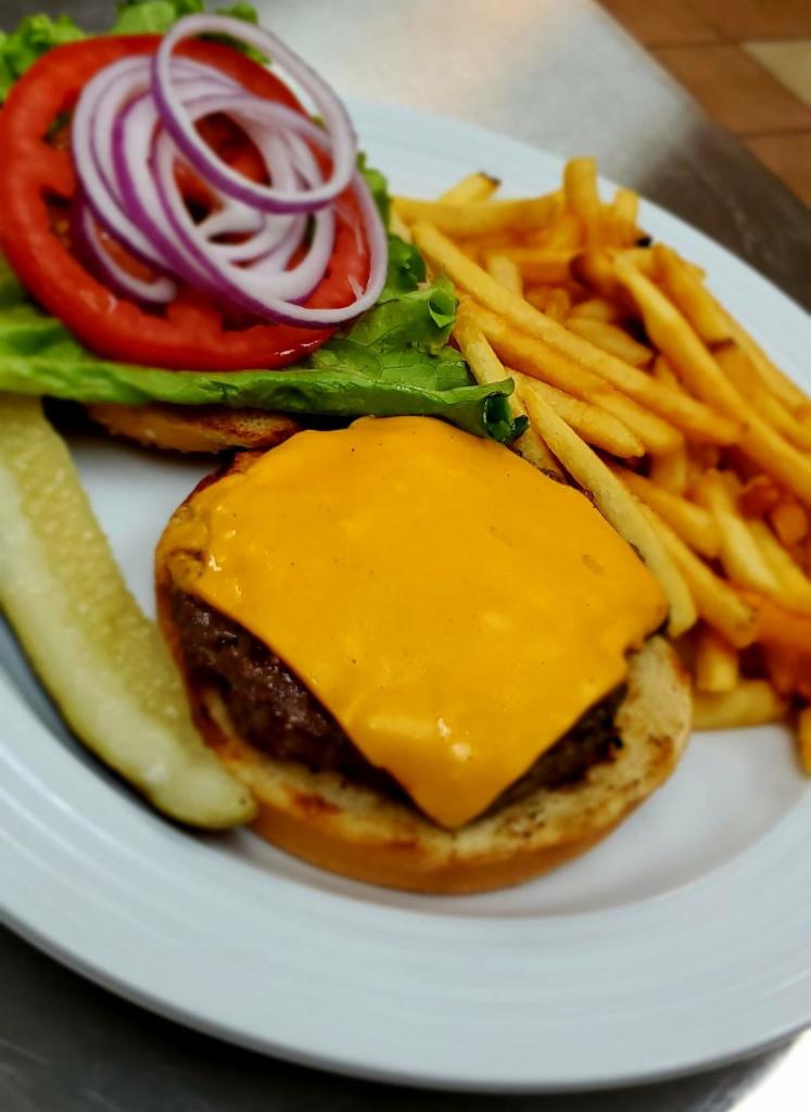 Cheeseburger · 6 oz. patty served with American cheese, tomatoes, lettuce, and onions on toasted sesame bun.
