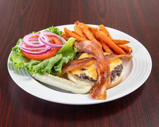 Bacon Cheeseburger · 6 oz. patty served with cheddar and Monterey cheese, bacon, tomatoes, lettuce, and onions on toasted sesame bun.