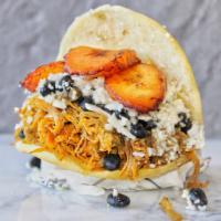 Pabellon Arepa · Shredded beef, black beans, sweet plantains and cheese.