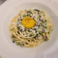 **Bucatini Carbonara · Housemade hollow spaghetti, egg yolks, house cured pancetta, Pecorino Romano.