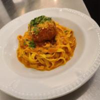 **Spaghetti Meatballs · Homemade spaghetti pasta, tomato basil sauce and a jumbo meatball.