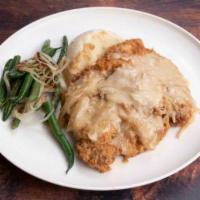 Smothered  Chop · Smothered pork chops, With your choice of two sides.