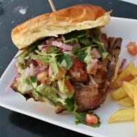 Pollo Saltedo · Comes with fries. It's a chicken sandwich with cooked onions and tomatoes with cilantro and ...
