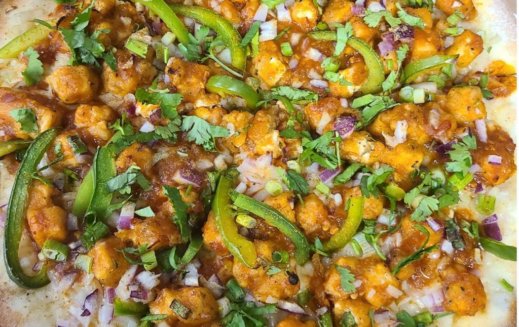 Chili-Dragon Pizza (Indian-Chinese) · Battered fried chicken, custom cheese blend, red dragon sauce, green bell peppers, red onions, scallions, cilantro.
* Available with paneer for a vegetarian option.