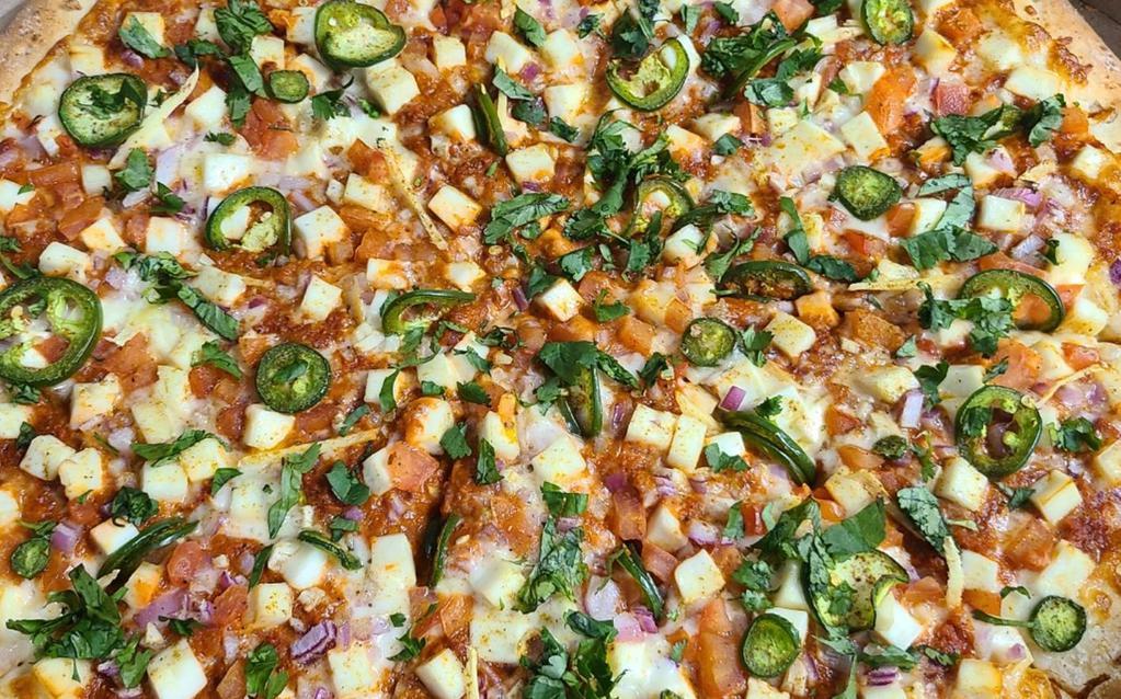 Pav-Bhaji Pizza (Indian) · Bombay street cart butter sauce, paneer, red onions, fresh jalapenos or Serrano peppers, ginger, garlic, tomatoes, cilantro.