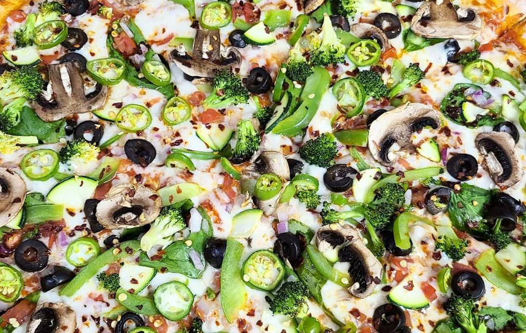 Greenhouse Pizza · Tomato sauce, custom cheese blends, green bell peppers, onions, tomatoes, black olives, spinach, green squash, broccoli, mushrooms. Add Indian style grilled chicken, ginger, garlic, jalapenos, and masala to get that Indian touch for an additional charge. Make it vegetarian for an extra charge.