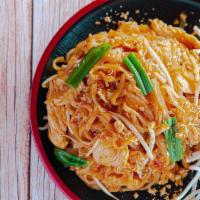 Pad Thai · Thai rice noodles stir-fried with egg, crushed peanuts, scallions and fresh bean sprouts.