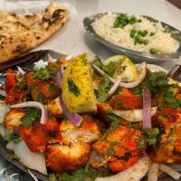 27. Chicken Tikka · Tender boneless pieces of chicken breast flavored with spices and grilled to perfection in t...