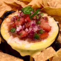 Queso Fundidohh · Contains nuts, Soy free, Gluten free. Cashew queso and Vida’s chorizo, topped with cilantro ...