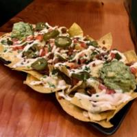 Vida Nachos · Contains Nuts, Soy free, Gluten free. Seriously amazing creamy cashew queso, loaded with you...