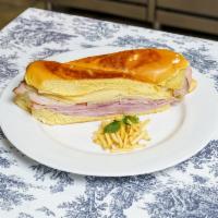Sandwich Media Noche · Toasted ham and cheese sandwich.