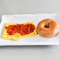 Spanish Omelet · Peppers, onion, mushrooms and cheese with picante tomato salsa. Served with a choice of a ba...