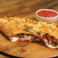 All Meat Calzone · Stuffed with pepperoni, ham, Italian sausage, bacon and our signature 3 cheeses, served with...