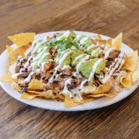 Super Nachos · Choice of meat, tortilla chips, beans, melted Jack cheese, sour cream, guacamole and salsa. 