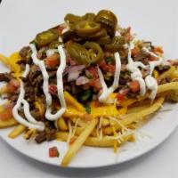 Loaded Fries · French fries with choice of meat: asada, pastor, pollo, sour cream, jalapeños, guacamole, an...