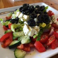 Greek Tomato Salad · (No Lettuce) Freshly chopped fresh tomato, cucumber, onion, black olive, feta and topped wit...