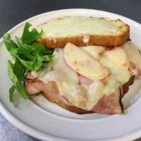 Baked Ham Monte Cristo · Ham, Swiss cheese, mayo, tomato, lettuce, oil and vinegar and topped with mozzarella.
