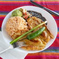 Pollo Adobado · Chicken breast served with rice, beans, guacamole and 3 tortillas.