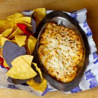 Buffalo Chicken Dip · Cheese sauce loaded with chicken, green chilis, and Frank’s red hot. Warm tortilla chips on ...